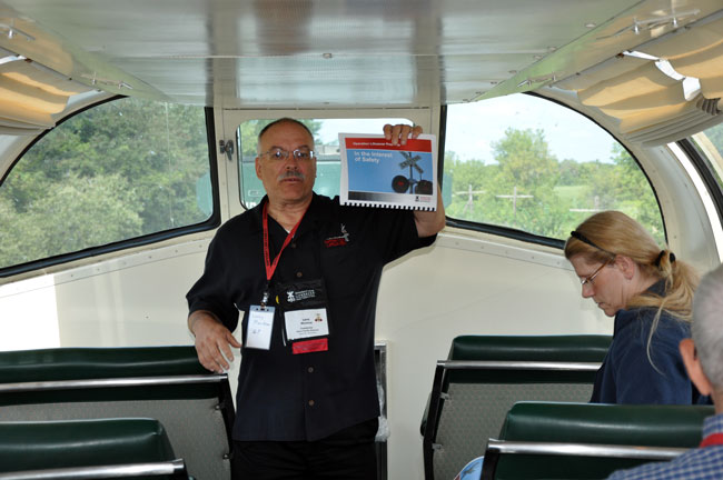 CNW-man-from-Janesveille-Larry Markow.jpg - Larry Markow making a presentation in the dome car.  Larry works at Janesville.